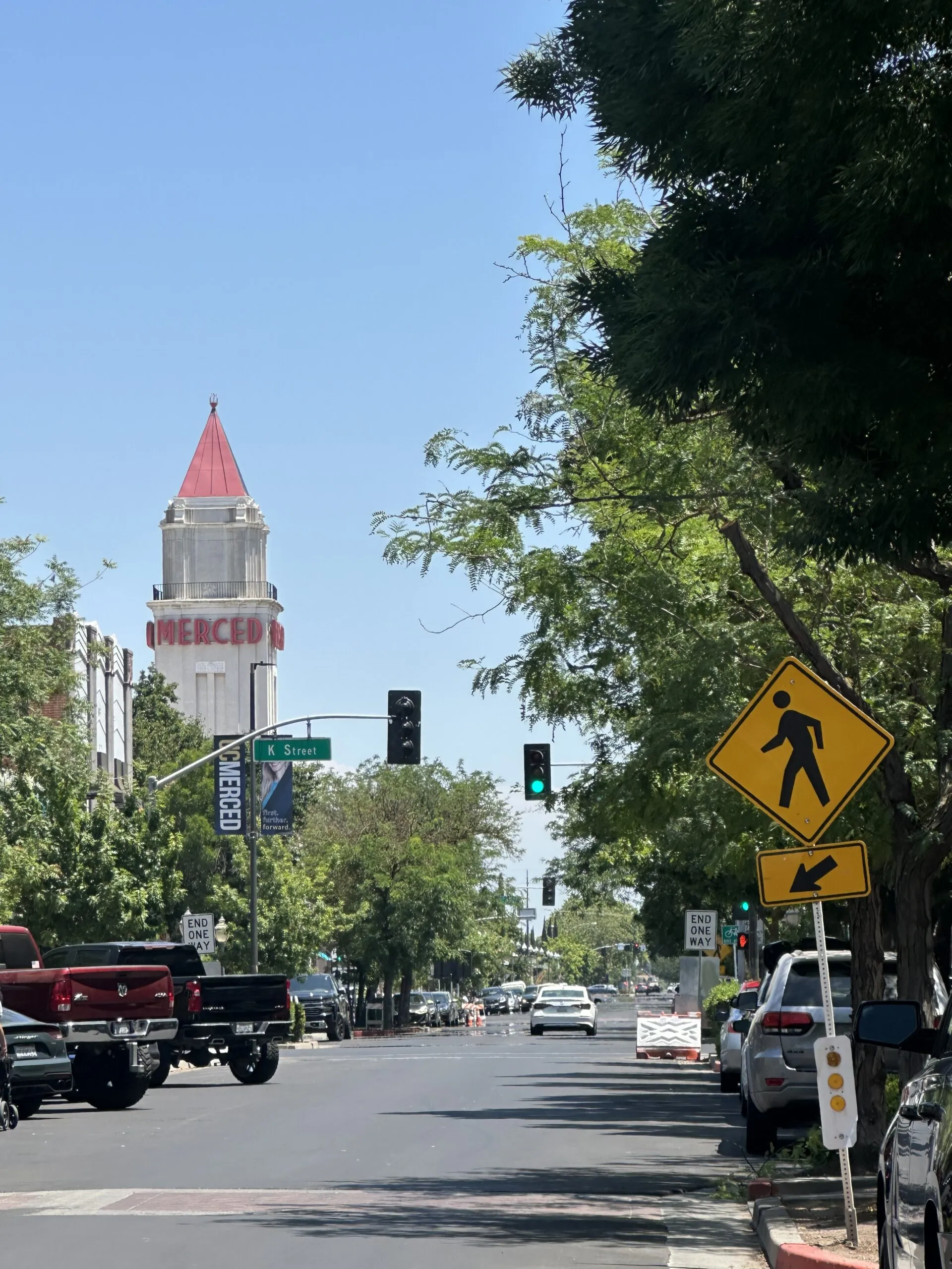 A downtown Merced street looking toward the Merced Theatre's red-tipped tower