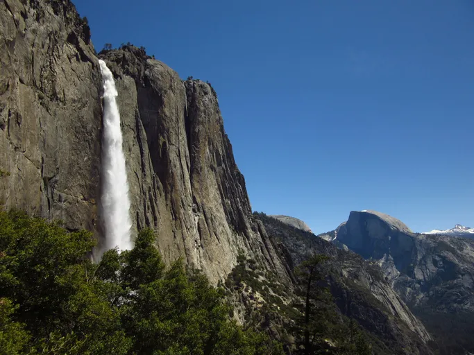 Convenient day trips from Merced to Yosemite National Park, featuring views of Yosemite Falls and Half Dome.